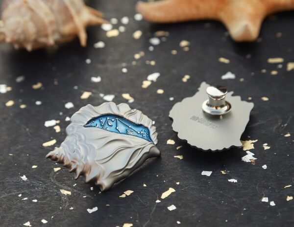 1617245607852.jpg Shell Design Metal Badge
