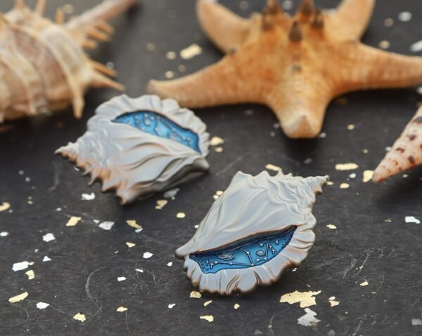 1617245607853.jpg Shell Design Metal Badge
