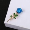 26d5437d-cc8f-4b92-94f7-0dccbb29856a.jpg Three-dimensional Rose Flower Rhindiamond-style Brooch